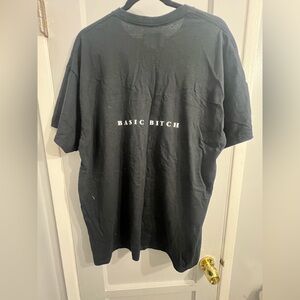 PrettyLittleThing 100 % Cotton Black Women’s Tee with design on back (NWOT)